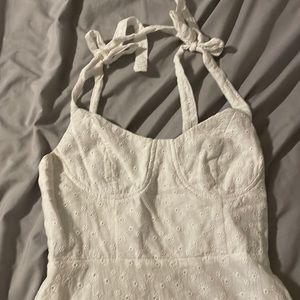 White mini dress with flower detail and tie straps